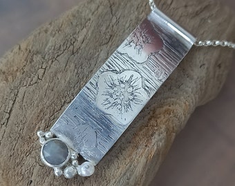 Unique, handmade sterling silver necklace with soft grey sapphire stone.
