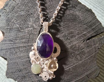 One off, unique, handmade sterling silver necklace with encrustations and semiprecious stones.