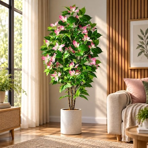 May include: A tall artificial flowering tree with vibrant green leaves and numerous pink and white blossoms. The plant is housed in a simple, cylindrical, light-colored speckled pot that sits directly on the floor, creating a vertical display.