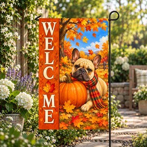 May include: A rectangular garden flag featuring a tan French Bulldog wearing a plaid scarf, resting beside a large orange pumpkin. The scene is set against a backdrop of autumn leaves and trees. The word WELCOME is printed vertically in white.