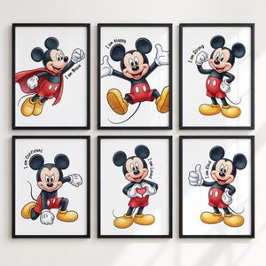 May include: A set of six framed wall art prints featuring Mickey Mouse in various poses with text. The prints show Mickey as brave with a red cape, happy, strong, confident, making a heart shape with hands, and kind with a thumbs up gesture.