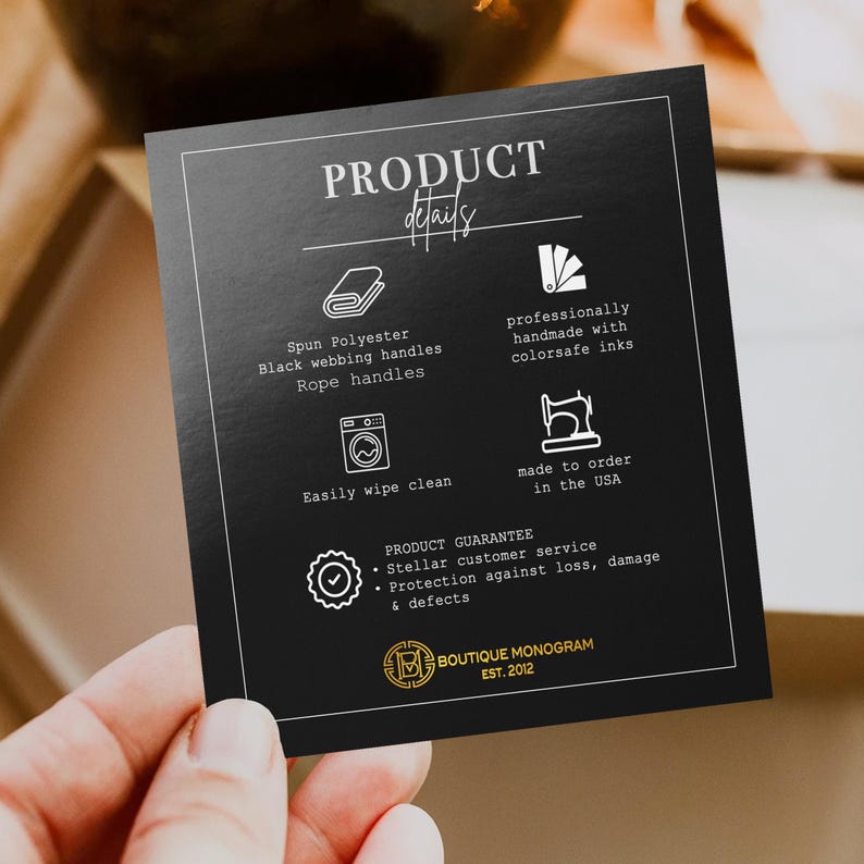 May include: A black card with white text and graphics, held by a hand. The card reads "PRODUCT details" and lists features like spun polyester, black webbing handles, and rope handles. It also mentions colorsafe inks and being made in the USA.
