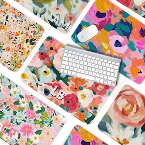 May include: Set of 10 colorful floral mousepads with different initial letters. The mousepads are made of a soft, smooth material and are perfect for protecting your desk from scratches. The mousepads are also great for adding a touch of personality to your workspace.