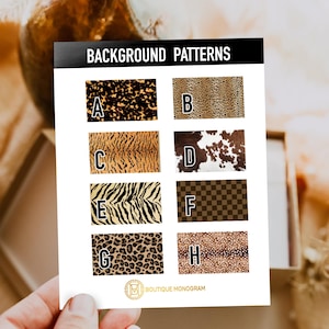 May include: A card displaying eight background patterns, including leopard, tiger, zebra, and cowhide prints. The card is labeled "BACKGROUND PATTERNS" and features the Boutique Monogram logo at the bottom. The patterns are labeled A through H.