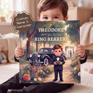 Peut inclure: Une couverture de livre carrée avec une illustration de dessin animé d'un jeune garçon en smoking tenant une petite boîte à bagues. Le texte indique THEODORE Will You Be Our RING BEARER? Une voiture noire vintage et un mariage sont visibles.