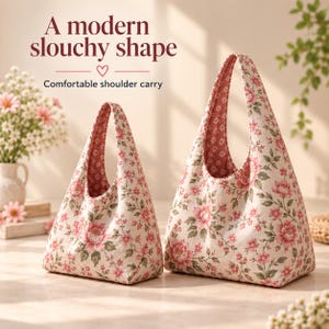 May include: Two hobo bags in different sizes featuring a floral pattern with pink flowers and green leaves on a cream background. The text A modern slouchy shape and Comfortable shoulder carry is printed above the bags.