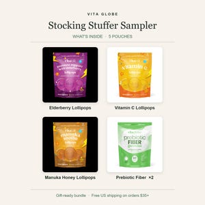 May include: A Vita Globe Stocking Stuffer Sampler containing five pouches: purple Immune Support Elderberry lollipops, orange Vitamin C lollipops, brown Manuka Soothe honey lollipops, and two green Prebiotic Fiber gummies pouches, all displayed with labels.
