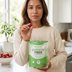 May include: A green and white pouch of Vitaglobe prebiotic fiber gummies. The packaging features the text 'vitaglobe', 'prebiotic FIBER gummies', 'contributes to a healthy digestive tract', 'non gmo vegan delicious', and '60 gummies'.