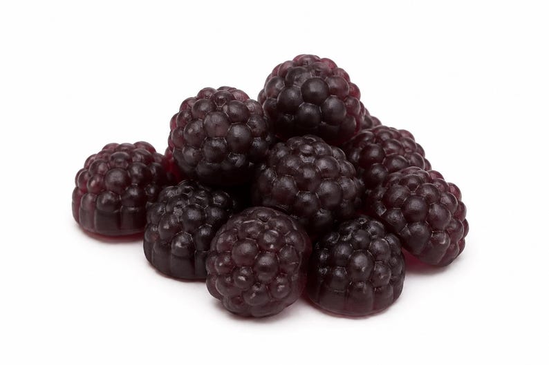 May include: A small pile of dark purple, translucent gummy candies shaped like blackberries. Each individual piece features a textured, bumpy surface that mimics the appearance of real fruit drupelets, with a glossy finish and deep violet color.