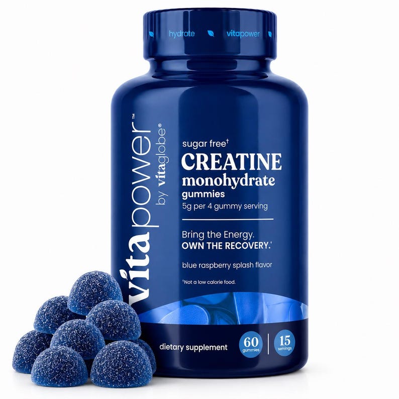 May include: A dark blue plastic bottle of VitaPower by vitaglobe sugar free creatine monohydrate gummies with 5g per 4 gummy serving, blue raspberry splash flavor, 60 gummies, and 15 servings, accompanied by a pile of dark blue sugar-coated gummies.