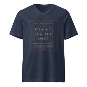 May include: A navy blue V-neck t-shirt featuring a square graphic with the text A TRULY REMARKABLE PROOF, the mathematical equation x^n + y^n &ne; z^n, n &isin; ℤ, n > 2, xyz &ne; 0, the word PROOF, MARGIN CAPACITY EXCEEDED, the year 1637, and a website URL.