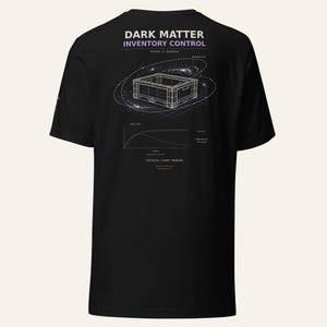 May include: A black short-sleeve t-shirt featuring a white graphic on the back. The design includes the text DARK MATTER INVENTORY CONTROL, a wireframe crate illustration surrounded by a galaxy, a scientific line graph, and the text PHYSICAL COUNT PENDING.