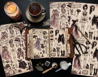 May include: A collection of Pretty Creepy paper doll sheets featuring skeleton figures and various outfits, a ring-bound journal with similar illustrations, a pair of black scissors, a paintbrush, buttons, and a small jar of adhesive on a dark surface.