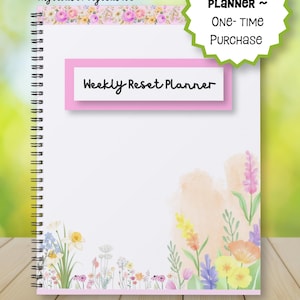 May include: A spiral-bound Weekly Reset Planner with a white cover featuring a floral border at the top and bottom. The centre has a pink rectangular label with the text Weekly Reset Planner. A green starburst graphic states 32 page PLANNER ~ One- Time PURCHASE.