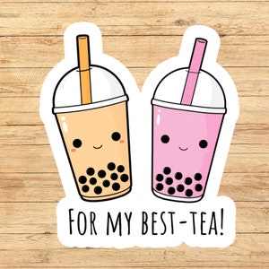 May include: Two cartoon bubble tea cups with smiling faces and boba pearls. The text "FOR MY BEST-TEA!" is below the cups.