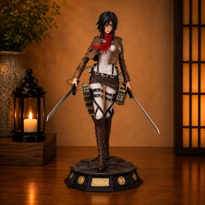 May include: A detailed anime-style action figure of a character with short black hair, wearing a brown jacket, white shirt, and red scarf. The figure holds two silver swords, wears dark brown boots, and stands on a circular base with gold accents.