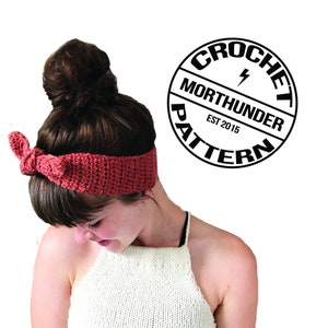 May include: A red crocheted headband with a bow tied on top. The headband is worn by a person with brown hair pulled back in a bun. The image also includes a black and white logo that reads "Crochet Pattern Morthunder Est 2015".