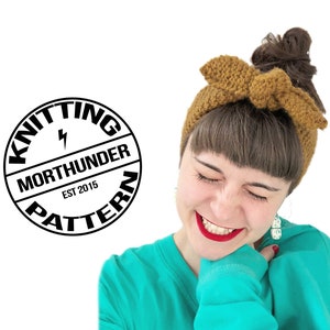 May include: A woman with brown hair wearing a brown knitted headband with a bow. She is smiling and wearing a turquoise shirt. The text "Knitting Pattern" is in a black circle with a lightning bolt and the text "Morthunder Est 2015" inside.