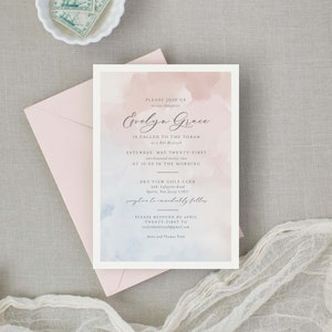May include: A watercolor-style invitation for a Bat Mitzvah celebration. The invitation features a pink and blue watercolor background with the text "Evelyn Grace is Called to the Torah as a Bat Mitzvah" in a script font. The invitation also includes the date and time of the event, the location, and the RSVP information.
