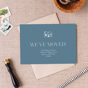 May include: A blue card with a white silhouette of two houses and the text "WE'VE MOVED!"  The Rodgers Family, 9 Meadow Ridge Court, Beacon, New York 12508.