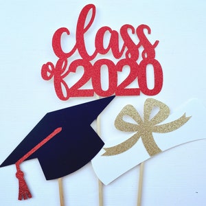 May include: Red glitter "Class of 2020" cake topper with a graduation cap and diploma. The graduation cap is black with a red tassel. The diploma is white with a gold glitter bow. Perfect for a graduation celebration.