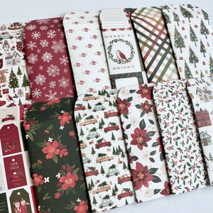 May include: A selection of Christmas-themed paper envelopes with diverse patterns. Designs include snowflakes, Christmas trees, floral arrangements, and holiday tags. The colour palette features red, green, and white.
