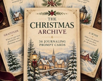 May include: A set of 36 journaling prompt cards titled The Christmas Archive, featuring cream-coloured cards with winter landscape illustrations, including snowy houses, pine trees, and lanterns, with text prompts like Winter Nights and Gratitude.