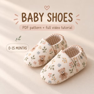 May include: A pair of baby shoes featuring a cream-colored fabric with a repeating pattern of brown teddy bears, green leaves, and small flowers. The text BABY SHOES, PDF pattern + full video tutorial, and 0-15 MONTHS is printed above the shoes.