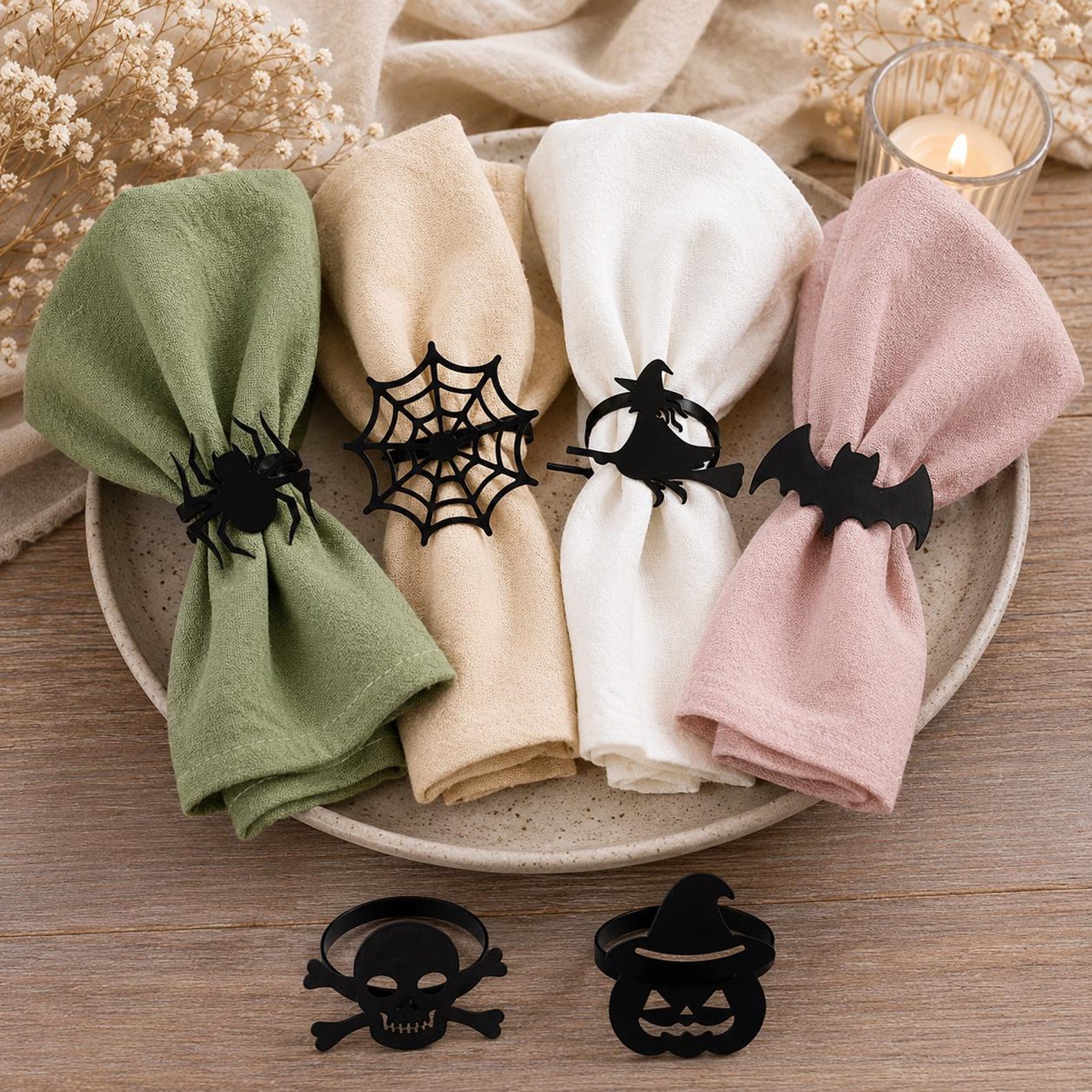Dark Rings on Soft Neutral Cloth Neutral cloth napkins gathered with dark Halloween rings in spider, web, bat and other silhouettes.