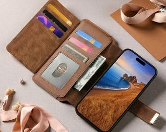 May include: A brown leather-textured wallet phone case in an open position, featuring multiple card slots containing various coloured cards, a clear ID window, and a cash compartment. A smartphone is attached, displaying a coastal landscape image.