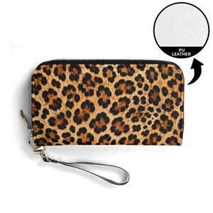 May include: A rectangular wallet featuring a brown and black leopard print pattern with a black zipper closure and a detachable wrist strap. An inset circle shows a white textured surface labeled PU LEATHER with an arrow pointing to the wallet.