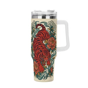 May include: A cream-colored stainless steel tumbler with a handle and a clear lid. The exterior features a detailed illustration of a red tiger with black stripes, surrounded by green bamboo stalks, blue swirling water patterns, and orange flowers.