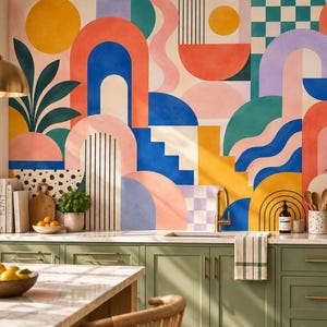 May include: A kitchen wall mural featuring a vibrant geometric pattern with arches, circles, waves, and checkered squares in shades of orange, blue, yellow, pink, and teal. The mural is positioned above sage green cabinets and a white marble countertop.