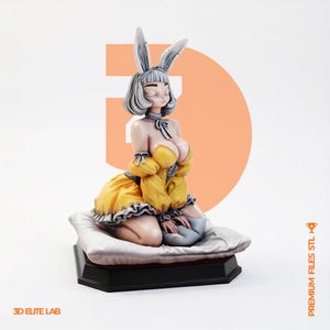 May include: A 3D printed figurine of a character with long rabbit ears and grey hair, wearing a yellow off-the-shoulder dress with grey ruffles. The character is kneeling on a white pillow atop a black base. Text reads 3D ELITE LAB and PREMIUM FILES STL.