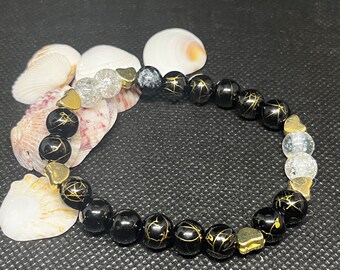 Black and gold beaded Bracelet, 7”, with gold heart charm spacers. Stacked bracelets.  Boho hippie bracelet.