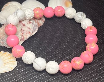 Pink and white Howlite Beaded 7” Diffuser Stackable Bracelet made with pink and white Howlite, and white Lava beads.