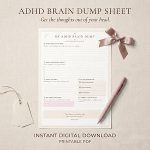 May include: A white ADHD brain dump sheet with lined sections for tasks, priorities, and thoughts. The document features the text My ADHD Brain Dump and includes a pink pen and a decorative satin ribbon bow placed on the upper right corner.