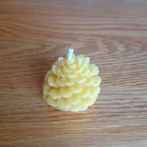1 small pinecone yellow beeswax candle.100 % natural  2-1/2 inches tall x 1-1/2 inches wide