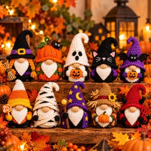 May include: A collection of ten crocheted gnomes arranged in two rows, featuring various Halloween-themed costumes including a witch, pumpkin, ghost, black cat, bat, candy corn, mummy, wizard, scarecrow, and devil, all with white beards.