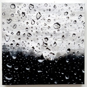 May include: A square canvas painting featuring a monochromatic grayscale design of water droplets. The composition transitions from a solid black base at the bottom to a lighter gray and white gradient at the top, with numerous circular shapes.