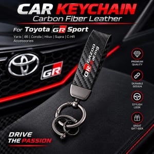 May include: A black carbon fiber leather keychain featuring the Gazoo Racing logo in white and red. The keychain has a dark metallic hardware finish with a main ring and two smaller attached rings. Text on the keychain reads CAR KEYCHAIN, Carbon Fiber Leather, For Toyota GR Sport, Yaris, 86, Corolla, Hilux, Supra, C-HR Accessories, and DRIVE THE PASSION.
