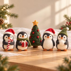 May include: A set of five needle-felted wool figures including four penguins and one Christmas tree. The penguins wear Santa hats or scarves, holding a candy cane, a gift, or a snowball. The green tree is topped with a yellow star.