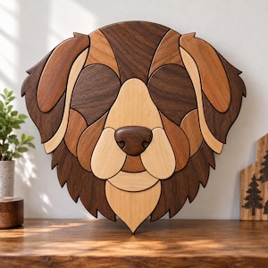 May include: A wall-mounted wooden dog head sculpture crafted from various shades of natural wood, including dark walnut, medium brown, and light cream tones. The piece features a geometric, segmented design forming the face, ears, and nose.