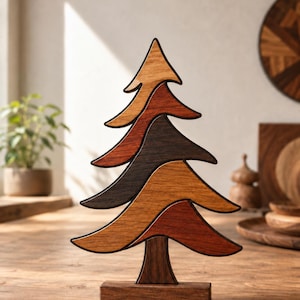 May include: A decorative wooden tree sculpture composed of five interlocking, curved segments in varying shades of brown, ranging from light tan to dark espresso. The tree stands on a rectangular wooden base, featuring smooth, dark-edged contours.