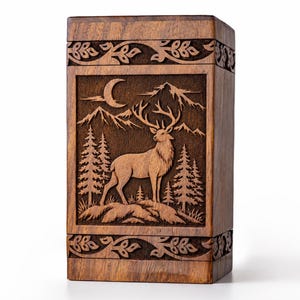 May include: A rectangular wooden urn featuring a deep relief carving of a stag standing in a forest with mountains and a crescent moon in the background. The top and bottom borders are decorated with a carved vine and leaf pattern.