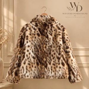 Women’s polyester faux fur jacket with a leopard-inspired printed pattern, cozy plush texture, long sleeves, and a warm winter design