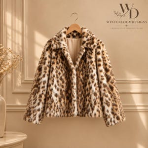 Women’s polyester faux fur jacket with a leopard-inspired printed pattern, cozy plush texture, long sleeves, and a warm winter design