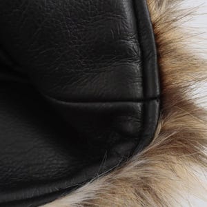 Women’s polyester faux fur jacket with a leopard-inspired printed pattern, cozy plush texture, long sleeves, and a warm winter design