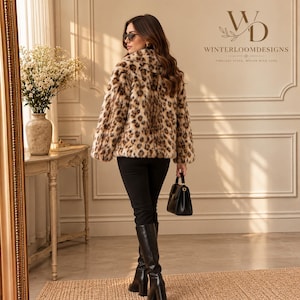 Women’s polyester faux fur jacket with a leopard-inspired printed pattern, cozy plush texture, long sleeves, and a warm winter design
