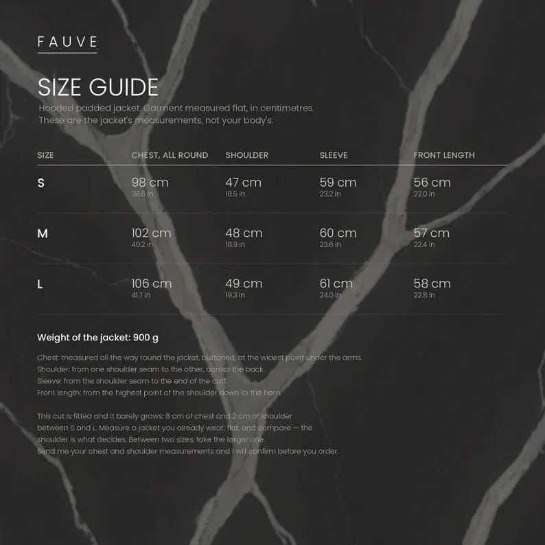 May include: A size guide chart for a hooded padded jacket by Fauve, featuring a dark marble background with white text. It lists measurements in centimeters and inches for sizes S, M, and L, including chest, shoulder, sleeve, and front length.